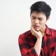 man holding jaw in pain